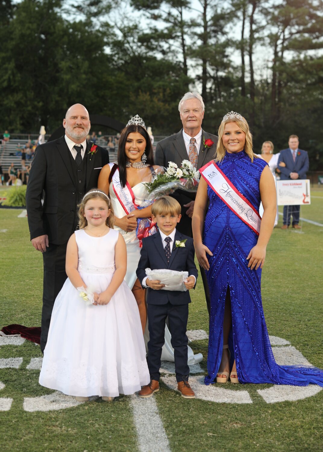 Pictured, front row from left, are Adley Moriarty and John Rollins Harris (Back) Tony Hatfield, 2023 Queen Mia Hatfield, 2022 Queen Kate Crawford Shepherd and Headmaster Steve Fleming